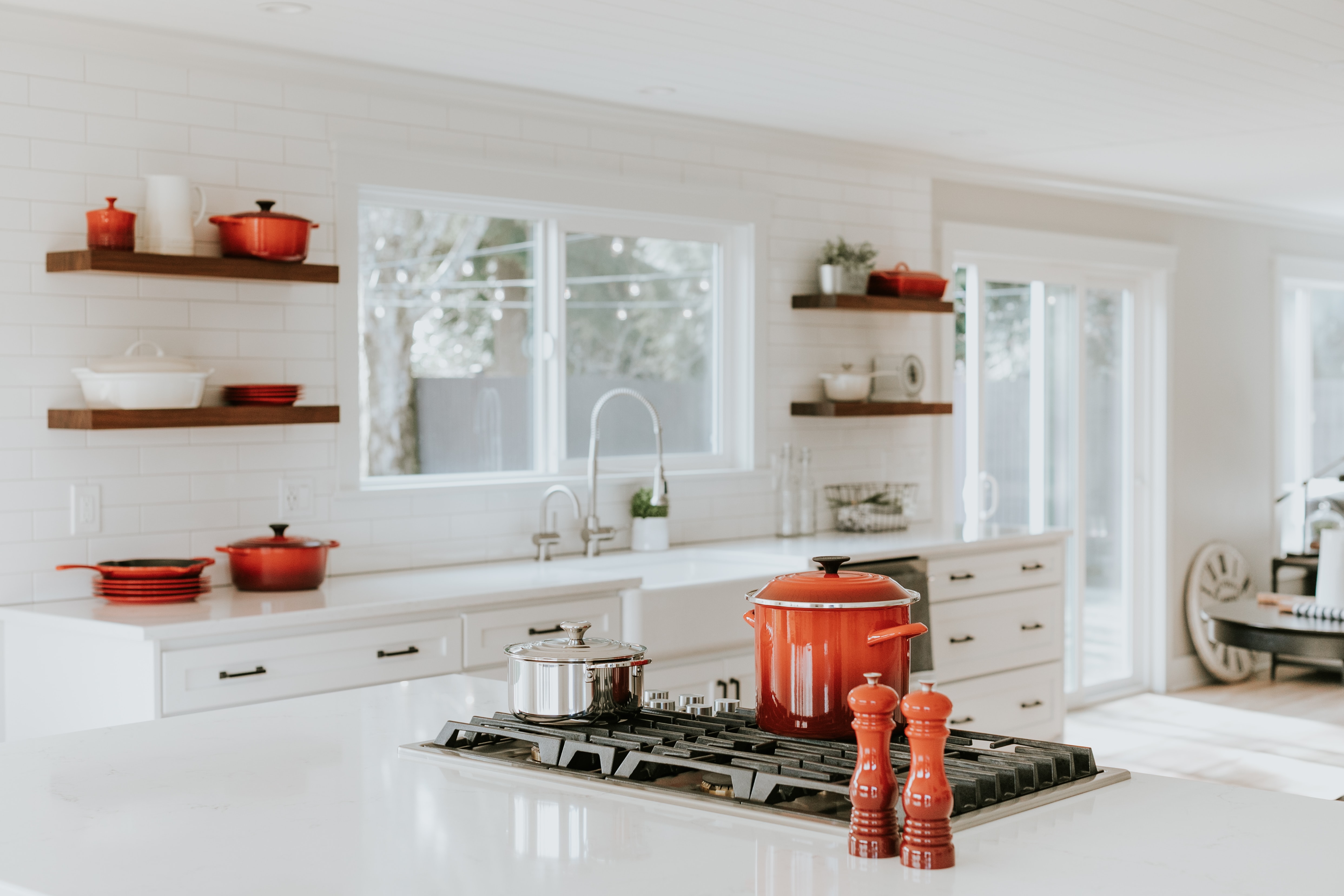 becca-tapert-sY5RjMB1KkE-unsplash Remodeled Kitchen with Red Cookware on stovetop