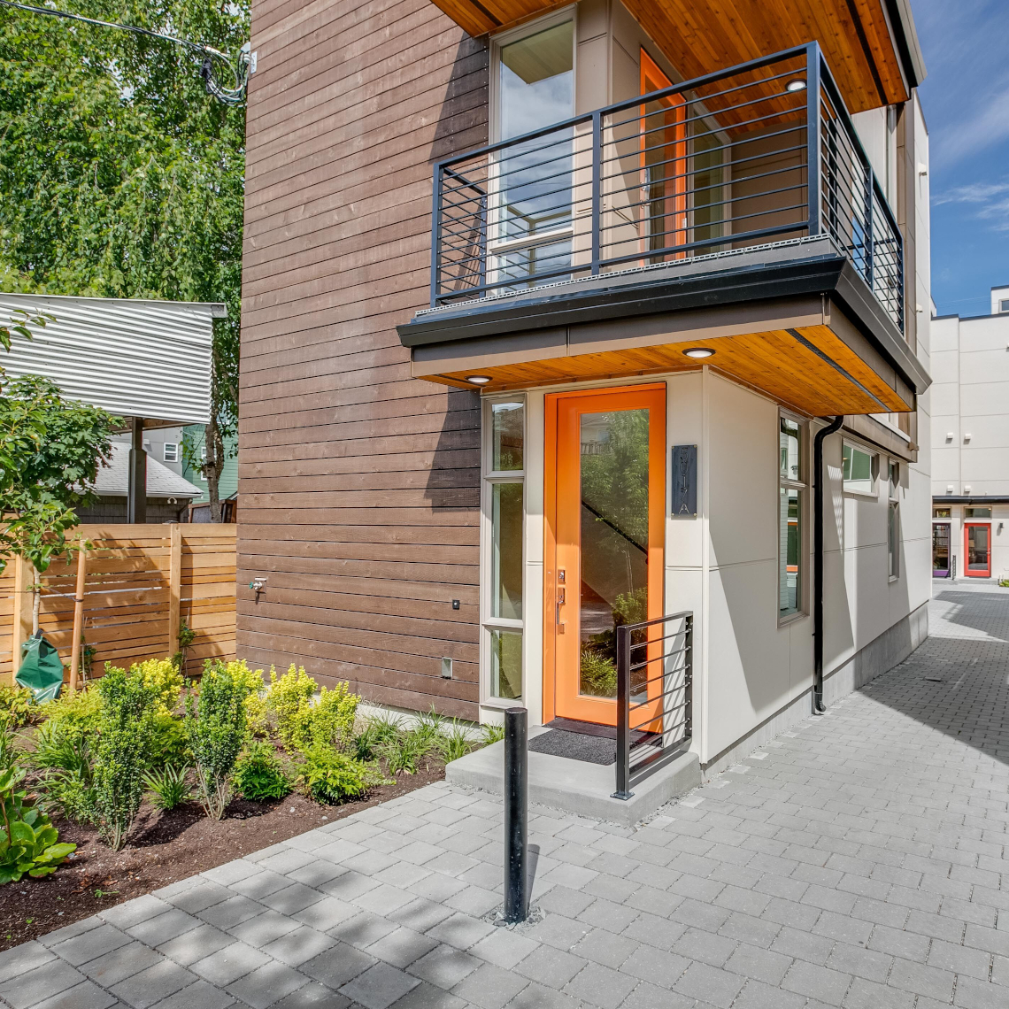 Haberzetle Homes Playful All-Electric 4-Star Townhomes exterior entry and garden