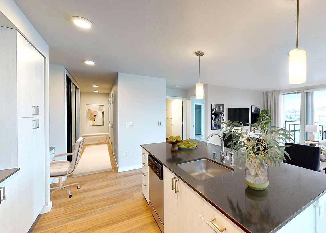 Stream Dexios Built Green 4-Star SLU apartment kitchen, hall, and desk space